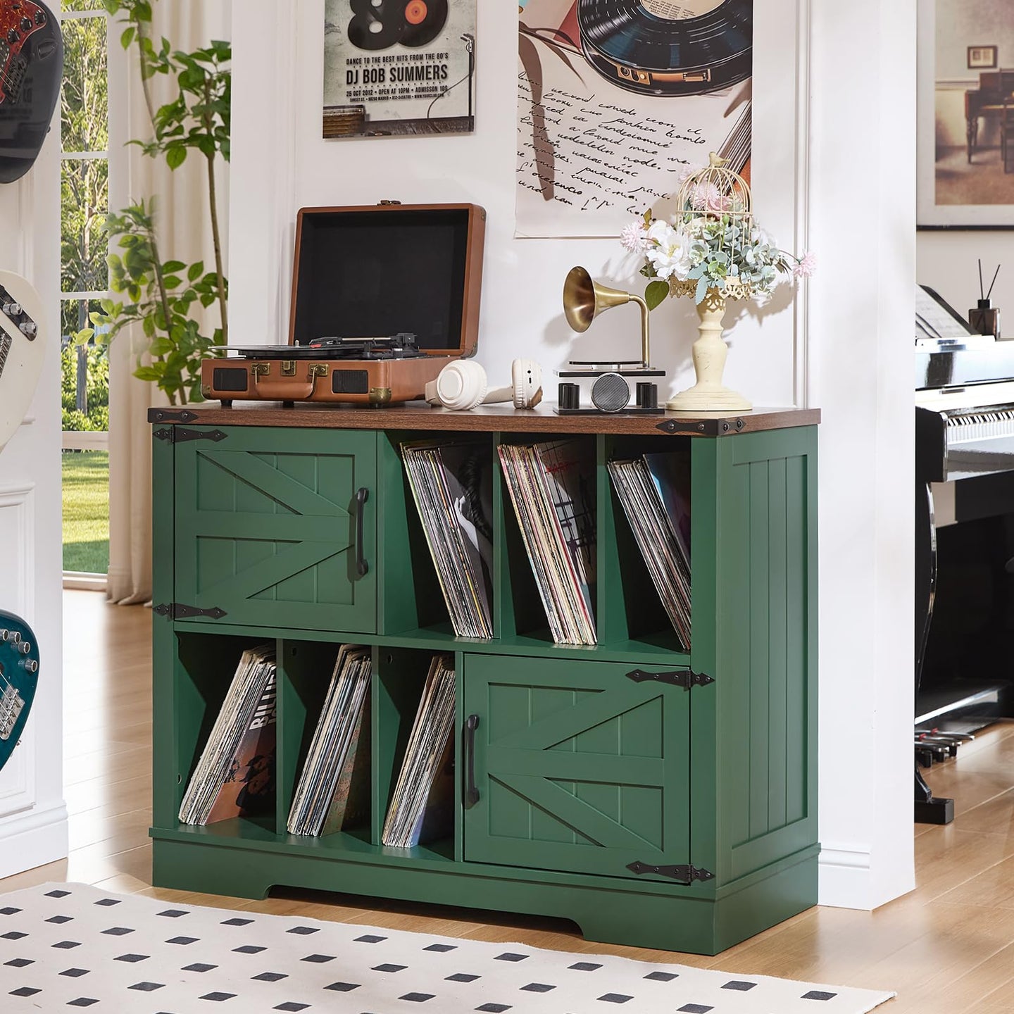 Green record player stand with vinyl storage shelves and barn-style cabinet doors.