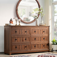 Brown wood dresser with 6 drawers and dark round knob pulls, farmhouse design