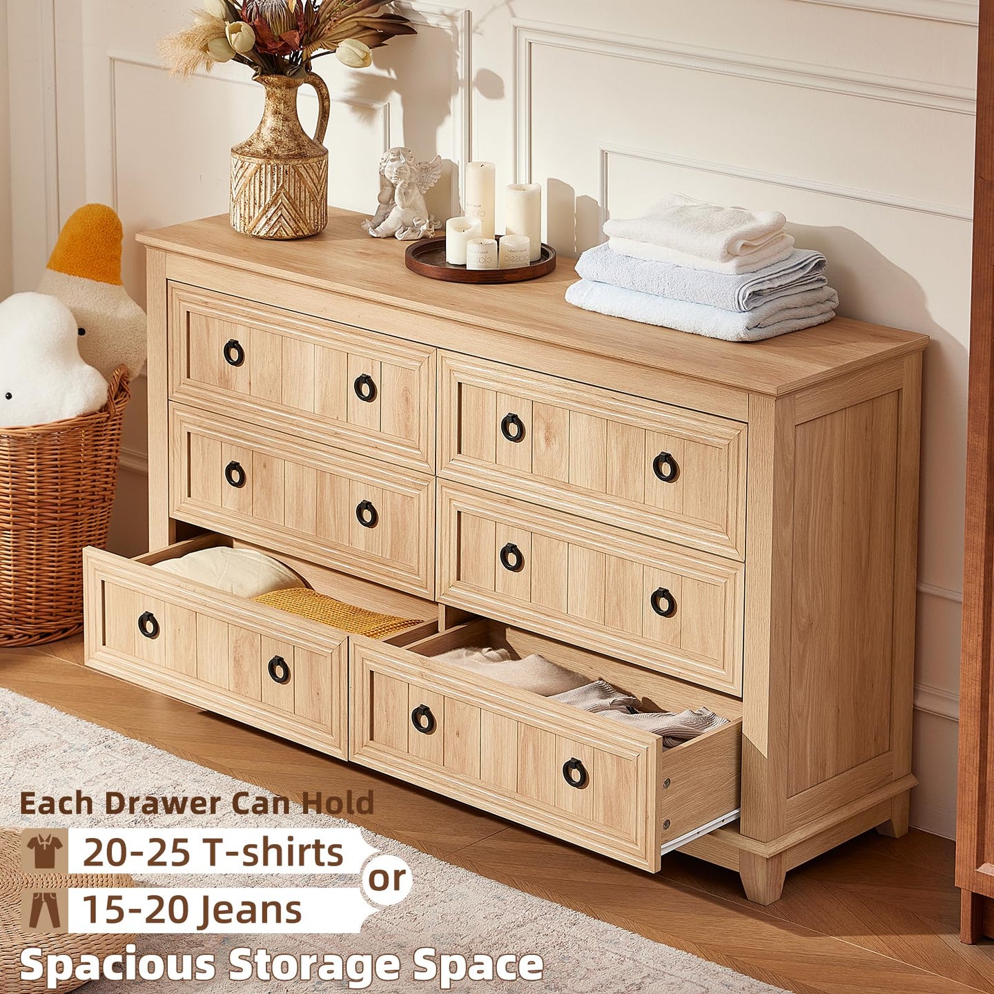 Natural wood dresser with six drawers and round knobs, open drawer revealing storage space