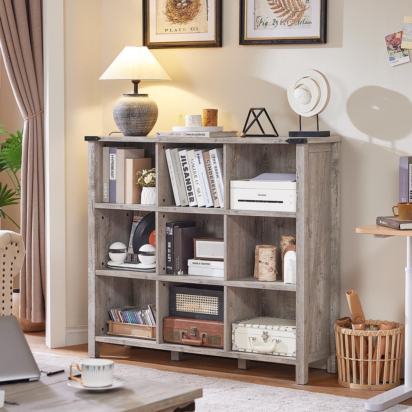 Grey oak console bookcase with open shelves and legs, filled with books and ornaments