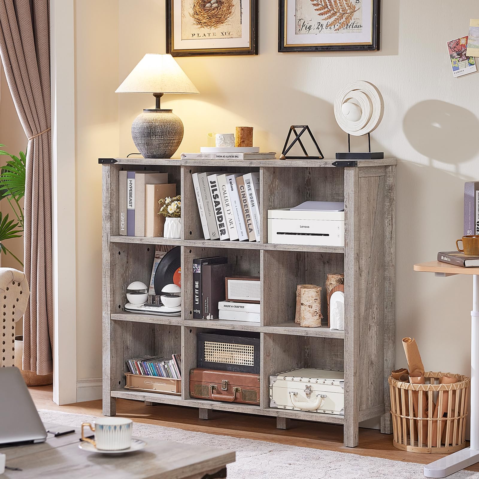Grey oak console bookcase with open shelves and legs, filled with books and ornaments