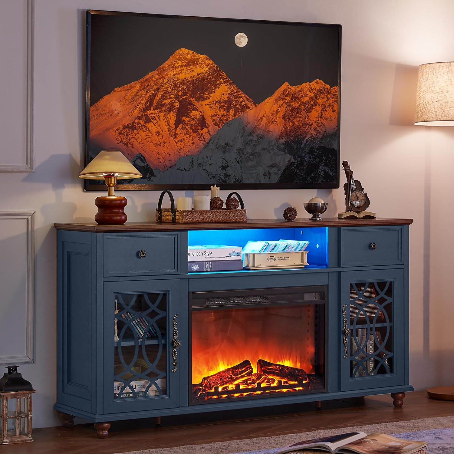 Blue farmhouse TV stand with electric fireplace and glass-door storage panels