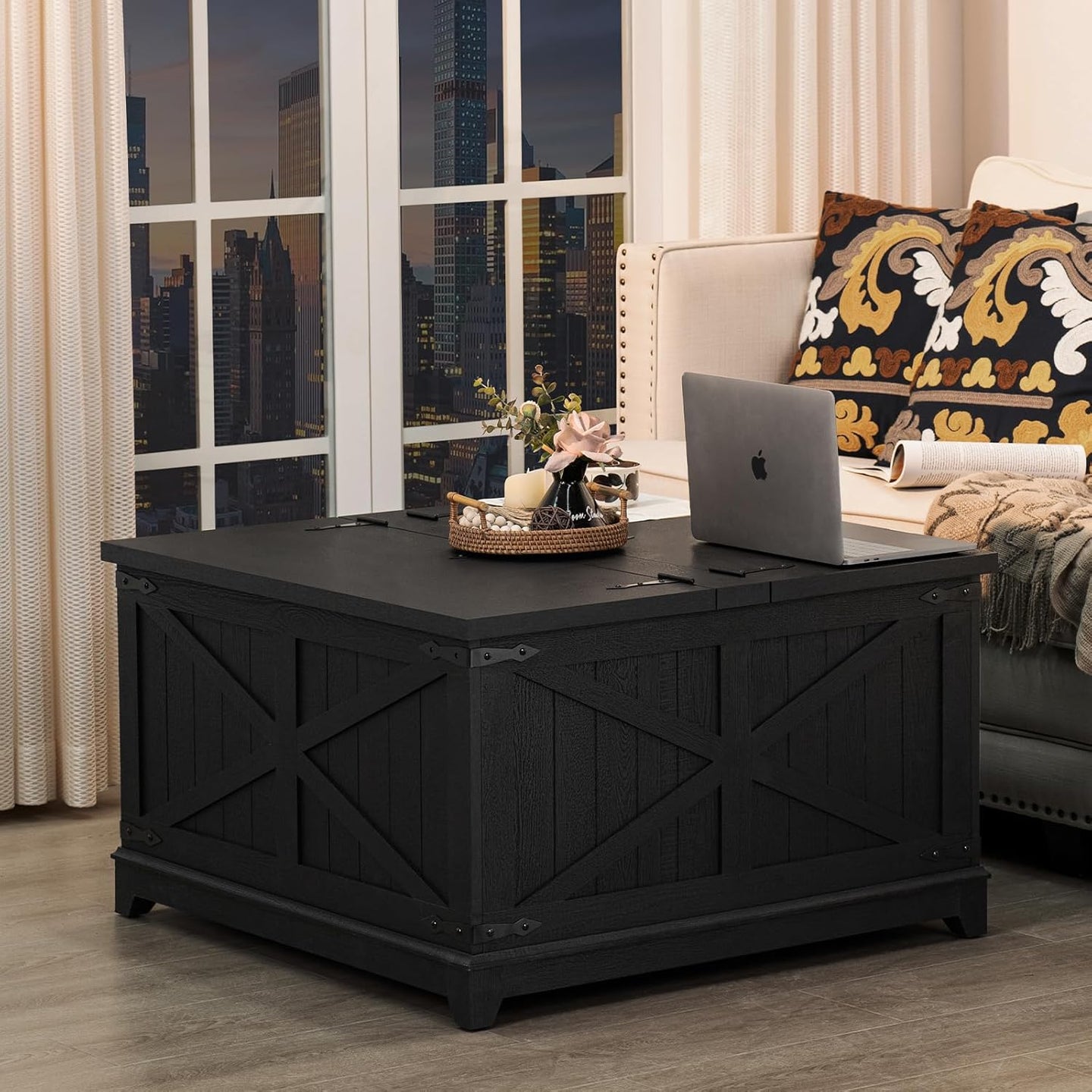 Black farmhouse coffee table with flip-top lid closed and decorative door-panel design