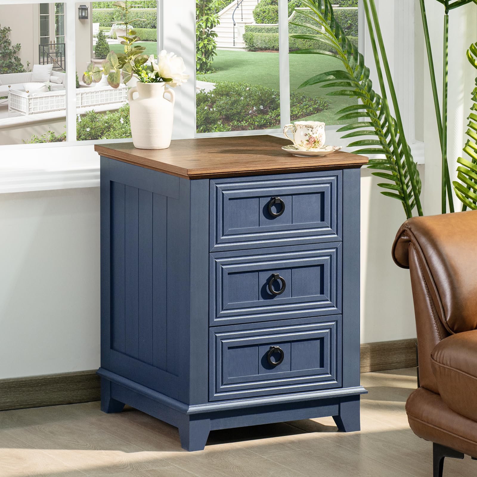 Blue farmhouse nightstand cabinet with 3 drawers, dark metal knobs, wood top.
