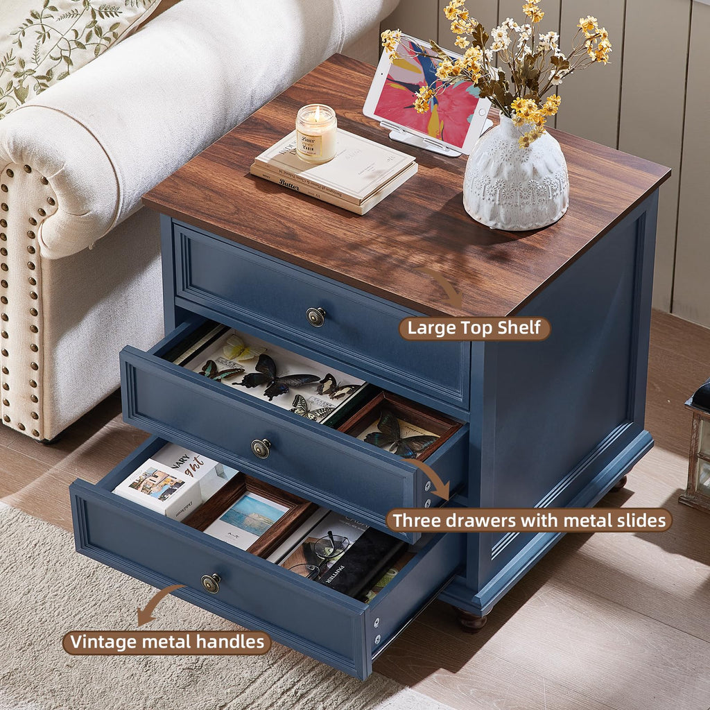 Dark blue nightstand with three drawers, open storage compartments, metal knob pulls