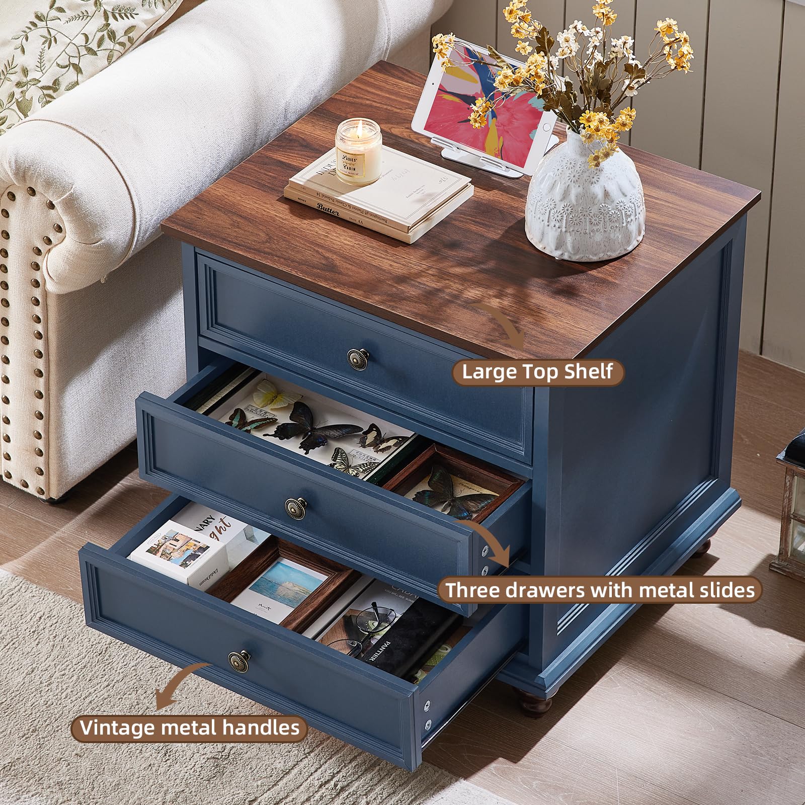 Dark blue nightstand with three drawers, open storage compartments, metal knob pulls