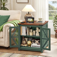 Green farmhouse end table with glass doors and open shelf, holding books and decor