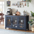 Navy sideboard cabinet with three glass doors, matte metal handles, and wooden top