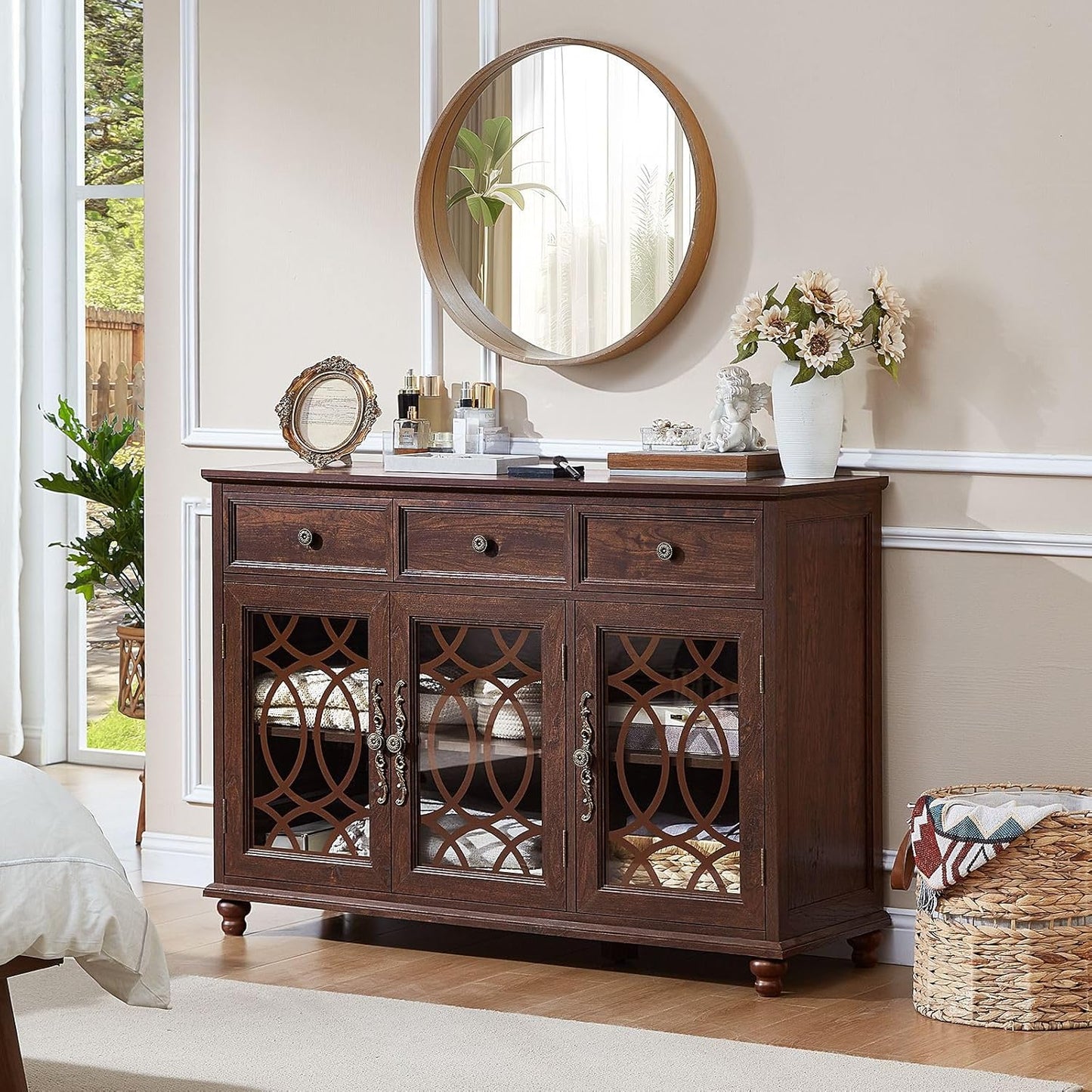 Dark wood sideboard cabinet with three drawers and arched glass door panels