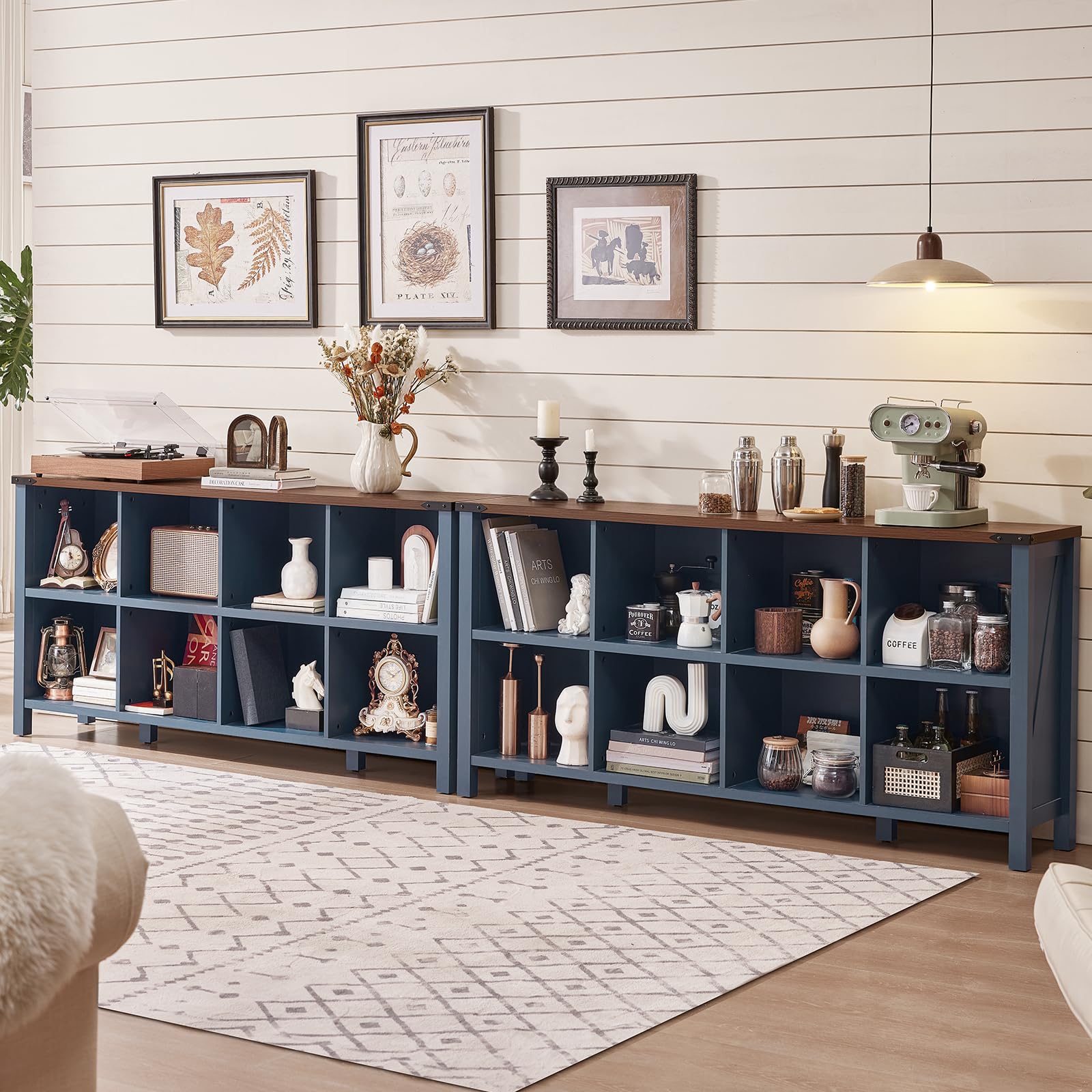 Blue farmhouse bookcase with open cubbies and lower shelves, styled with kitchen and decor items