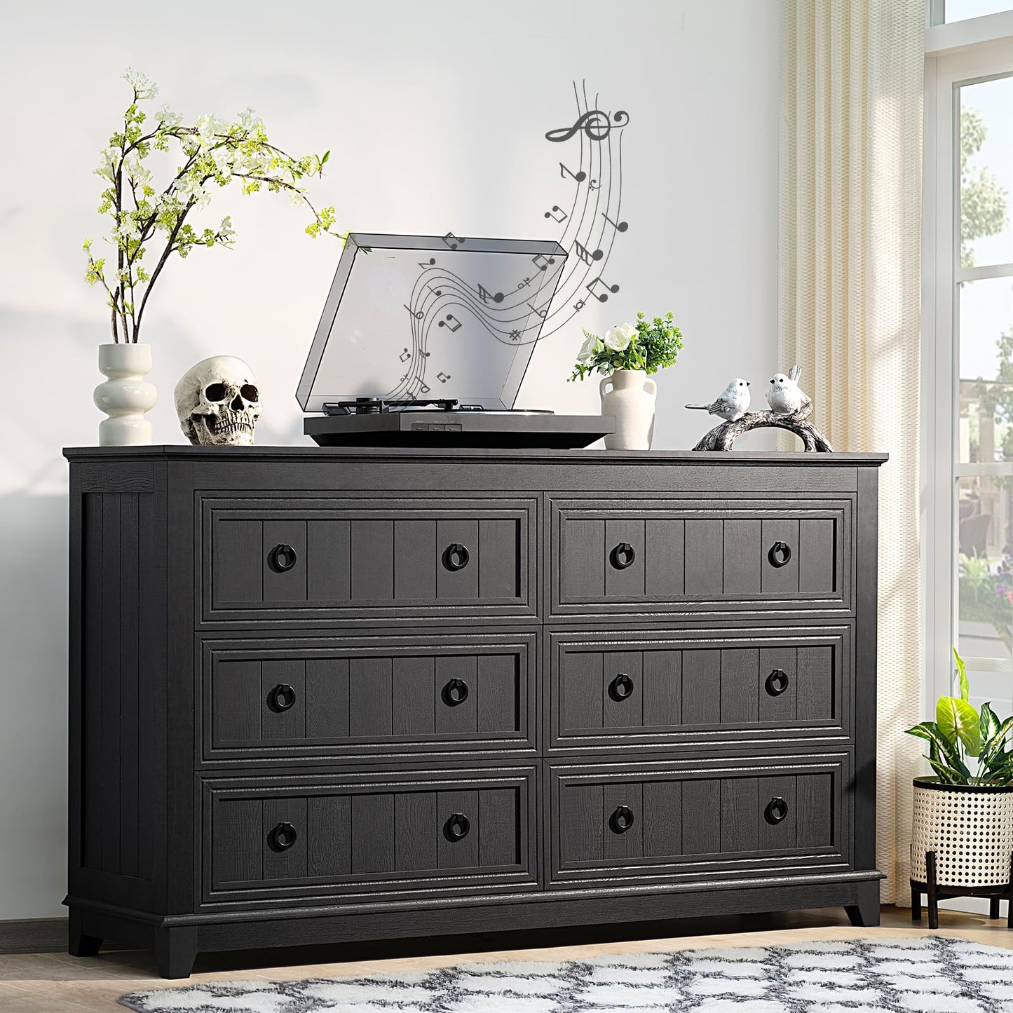 Dark wood dresser with 6 drawers and black round knob handles