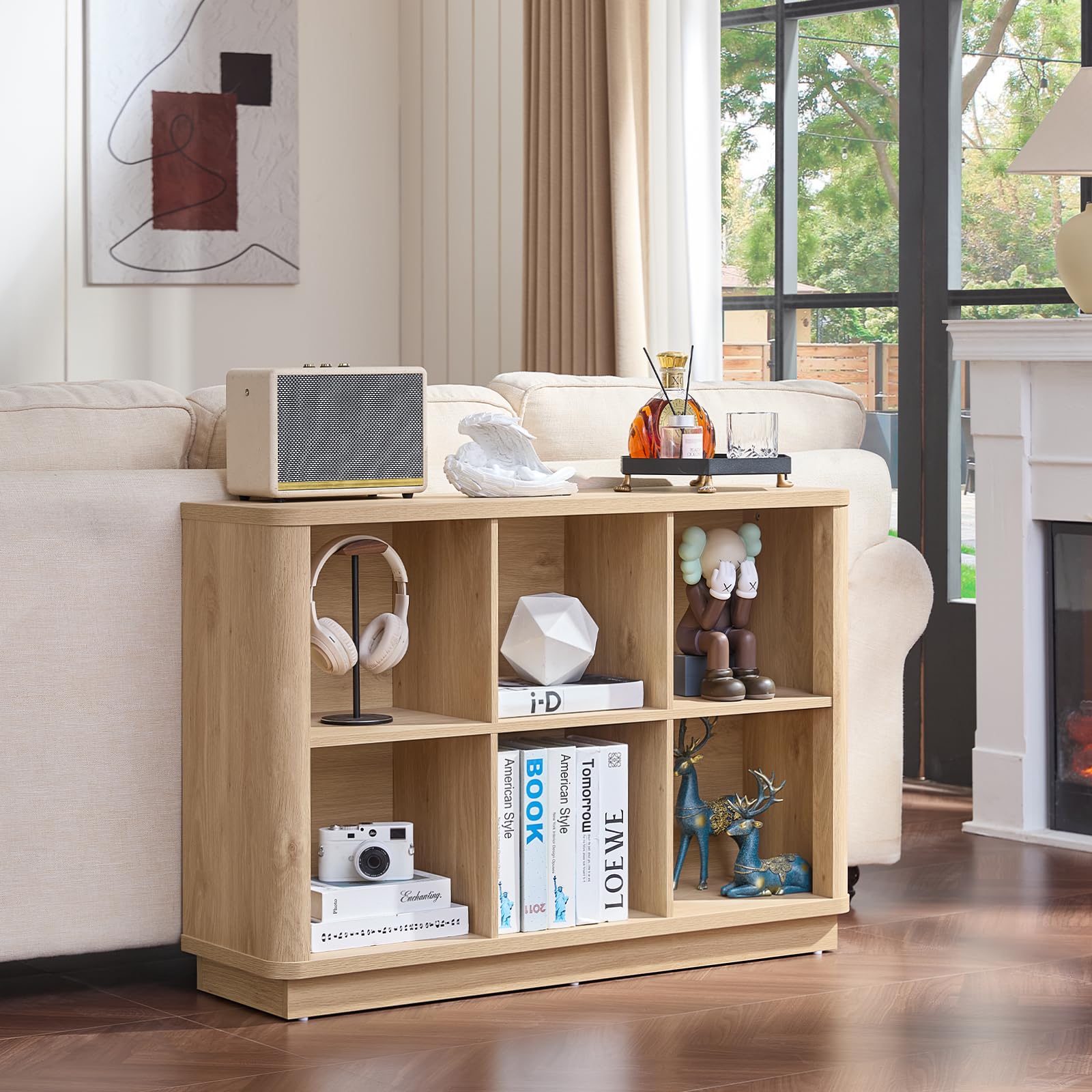 Light oak open cubby bookcase with square compartments for books, decor, and devices