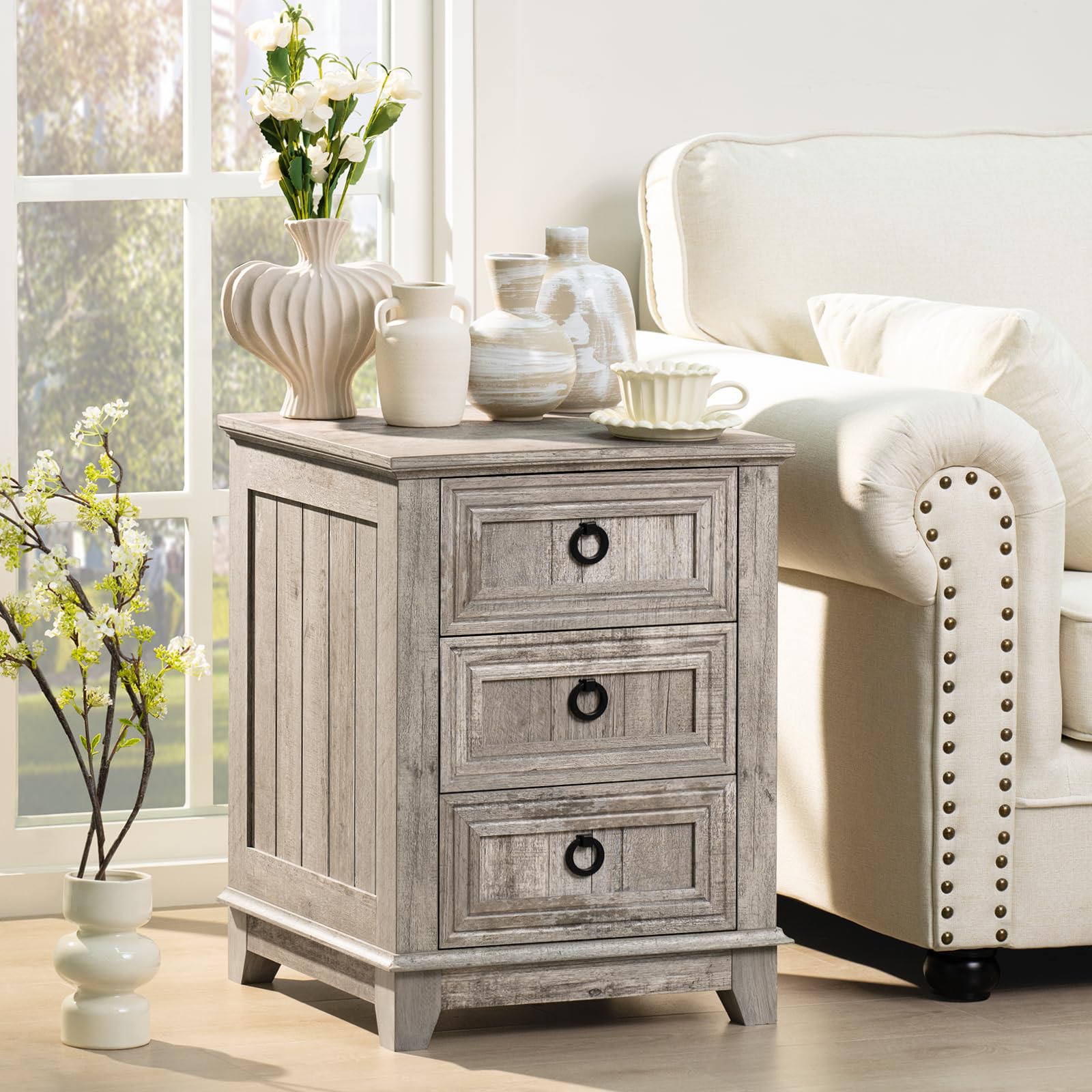 Gray farmhouse nightstand cabinet with three drawers and round metal handles