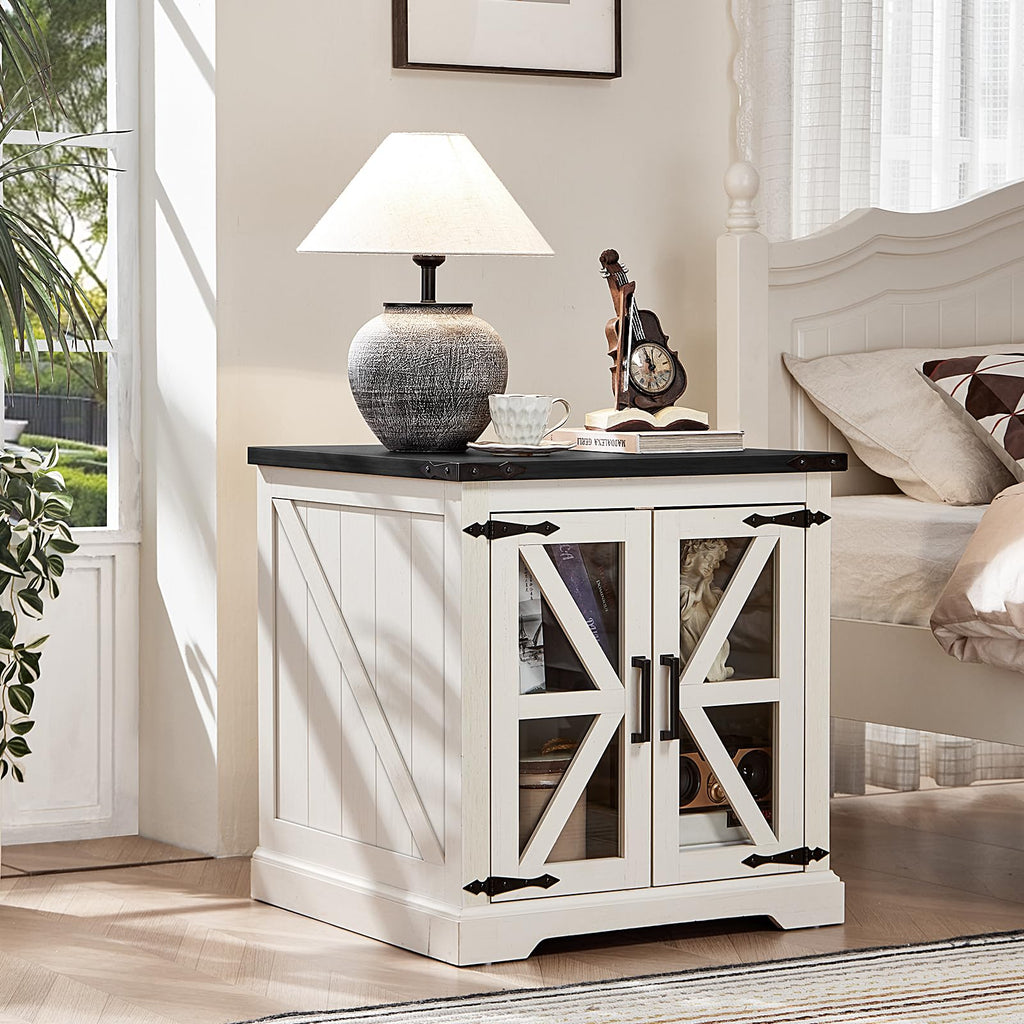 White end table with black top and double cabinet doors, X-frame panels and open shelf