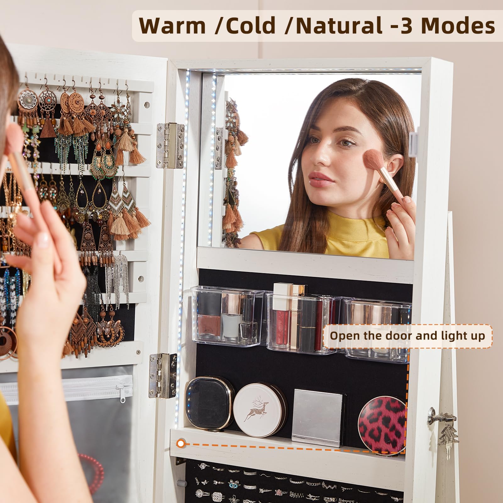 White fluted jewelry armoire cabinet open with mirror and illuminated organizer compartments