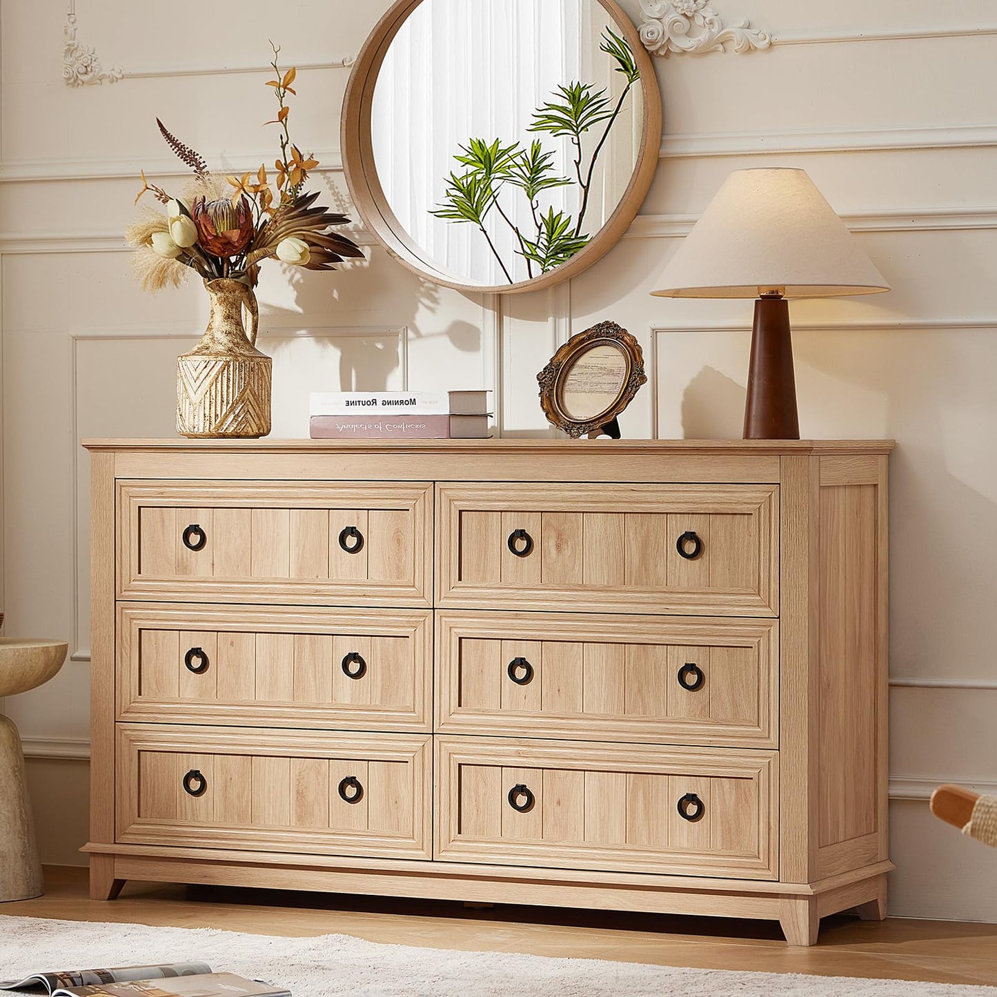 Natural wood 6-drawer dresser with black knobs and paneled drawer fronts
