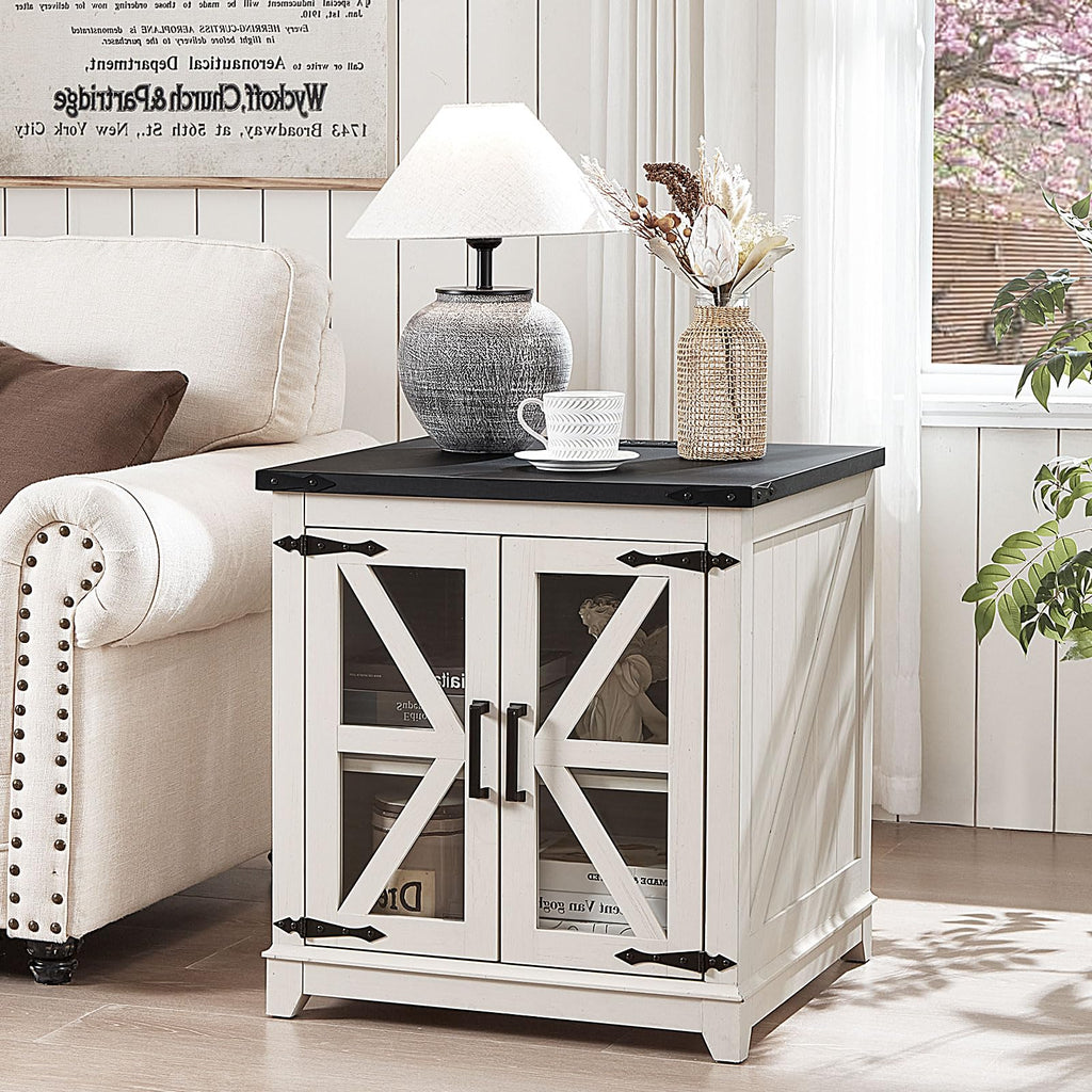 White wood end table with black top and glass barn-style doors for storage