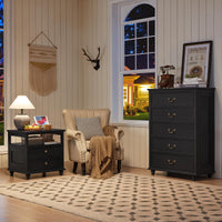 Black 5-drawer dresser with gold-tone handles and thick tabletop, positioned near window corner.