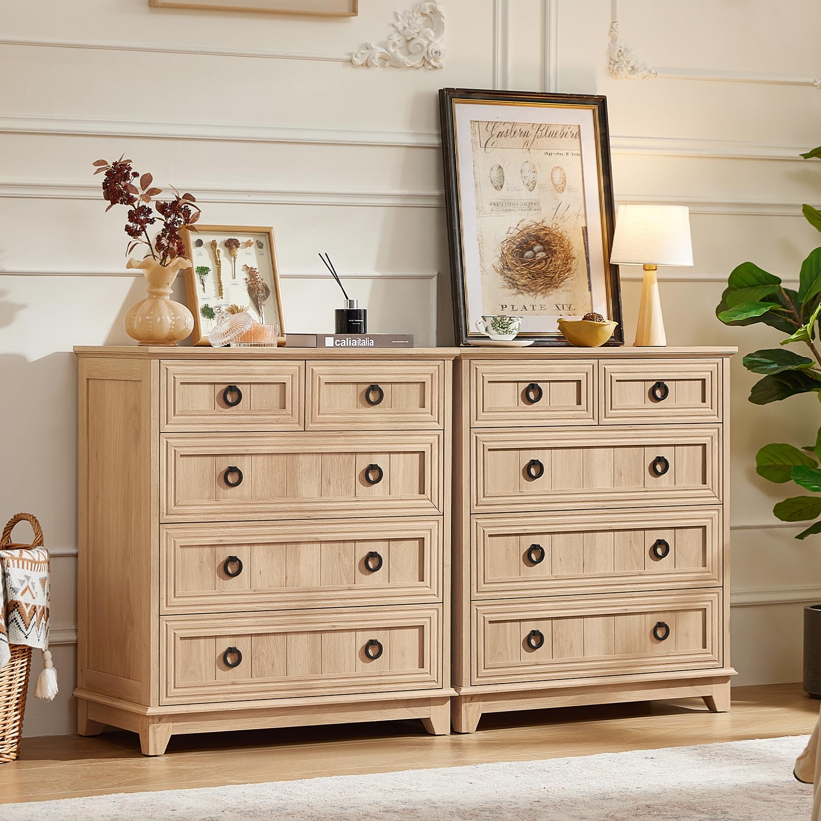 Light wood farmhouse dresser with multiple drawers and round metal knobs on the fronts.