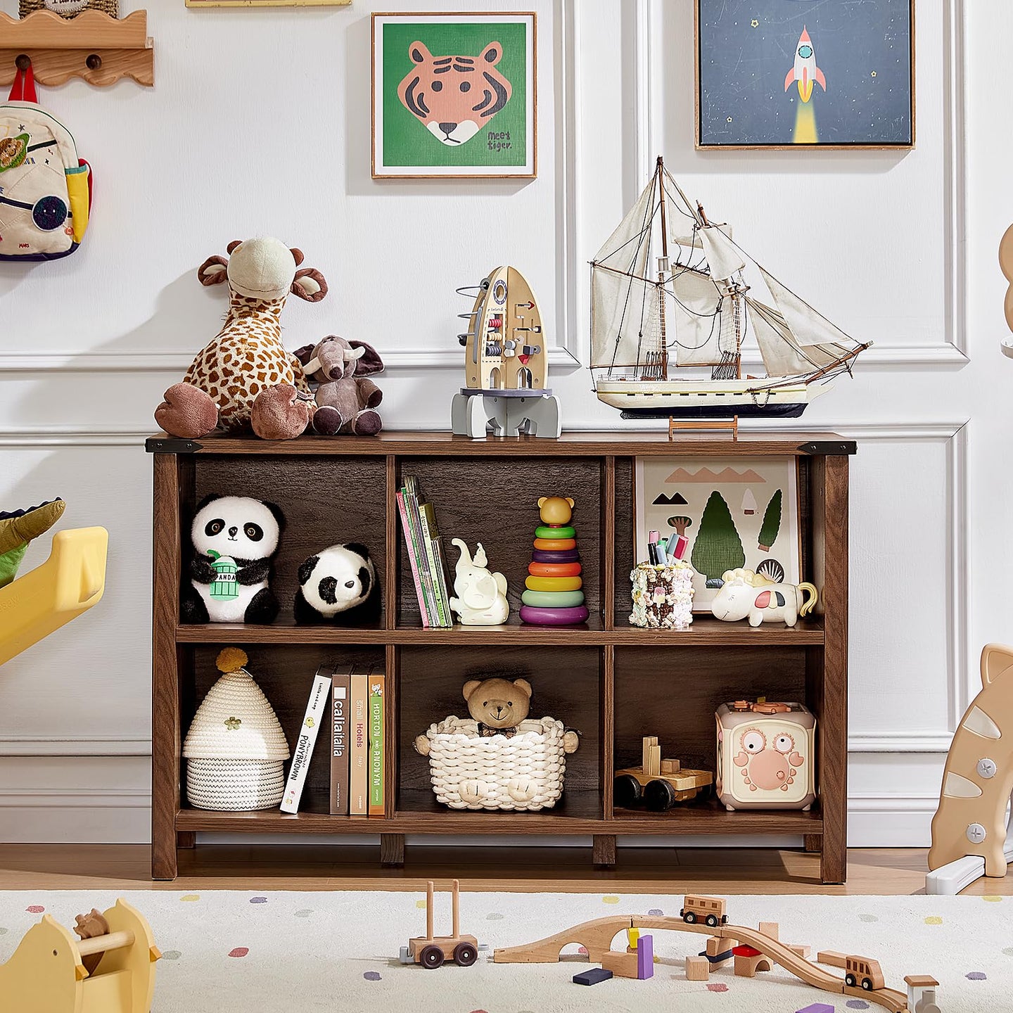 Brown storage bookcase with multiple open cubbies and lower compartments for decor