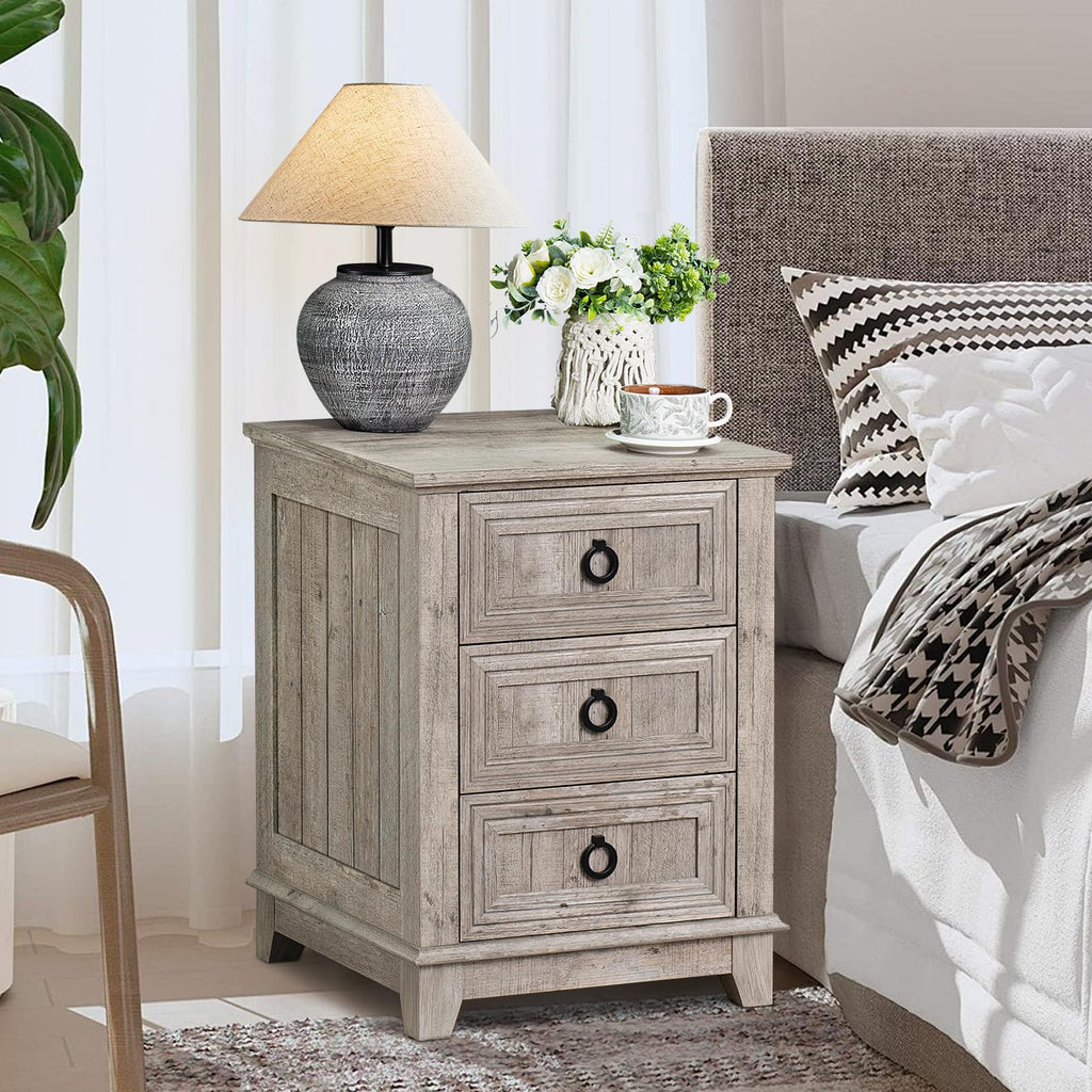 Gray wood nightstand with three drawers and round metal handles