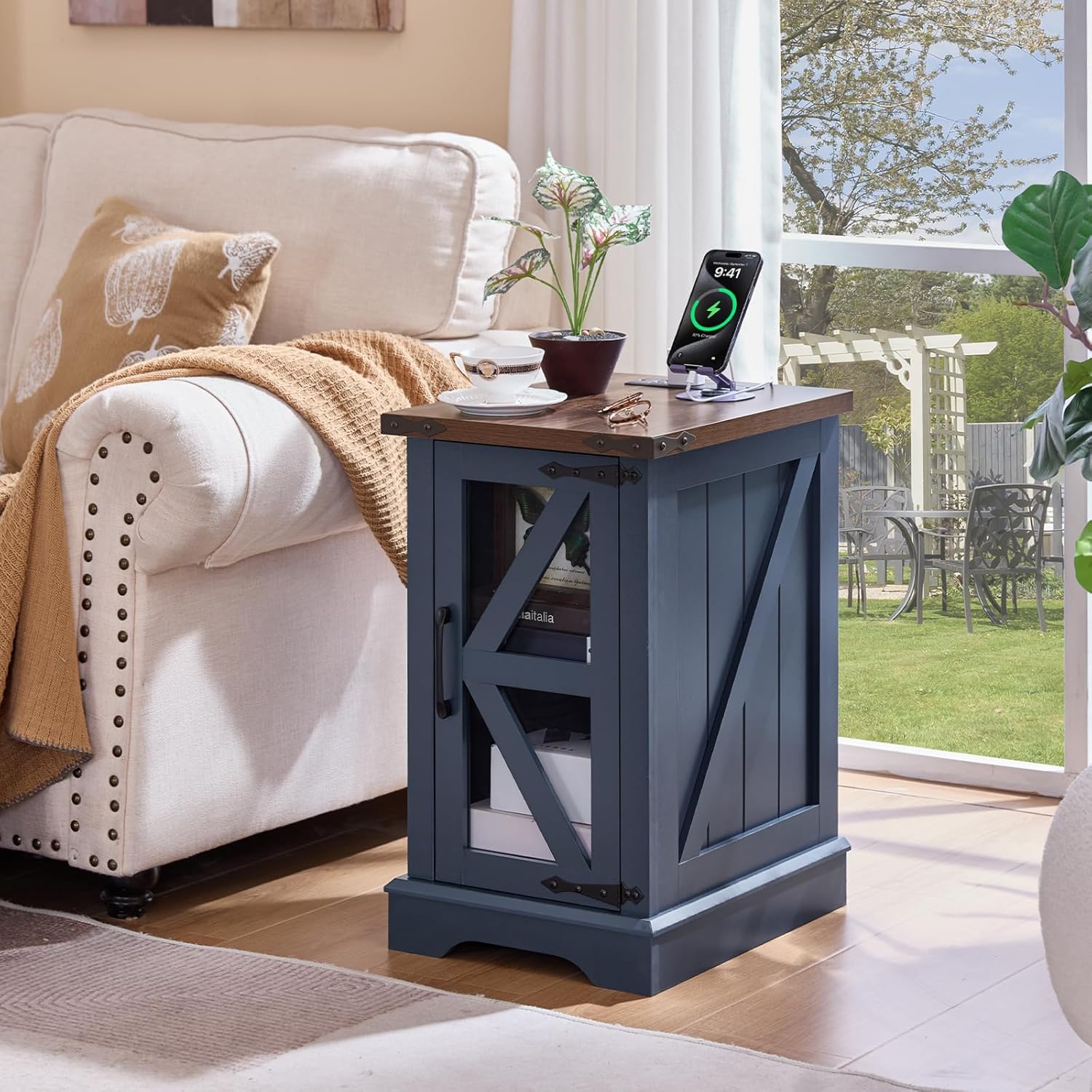 Navy blue farmhouse side table with barn-door style cabinet and open shelf
