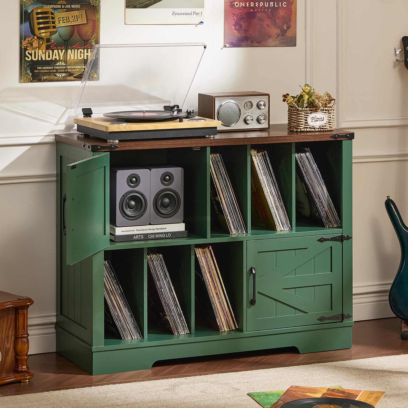 Green record player cabinet with open vinyl shelves, speaker area, and barn doors