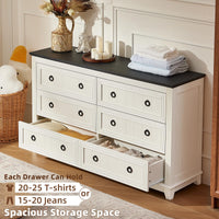 White wood dresser with six drawers, black round knobs, and open drawer space under the top