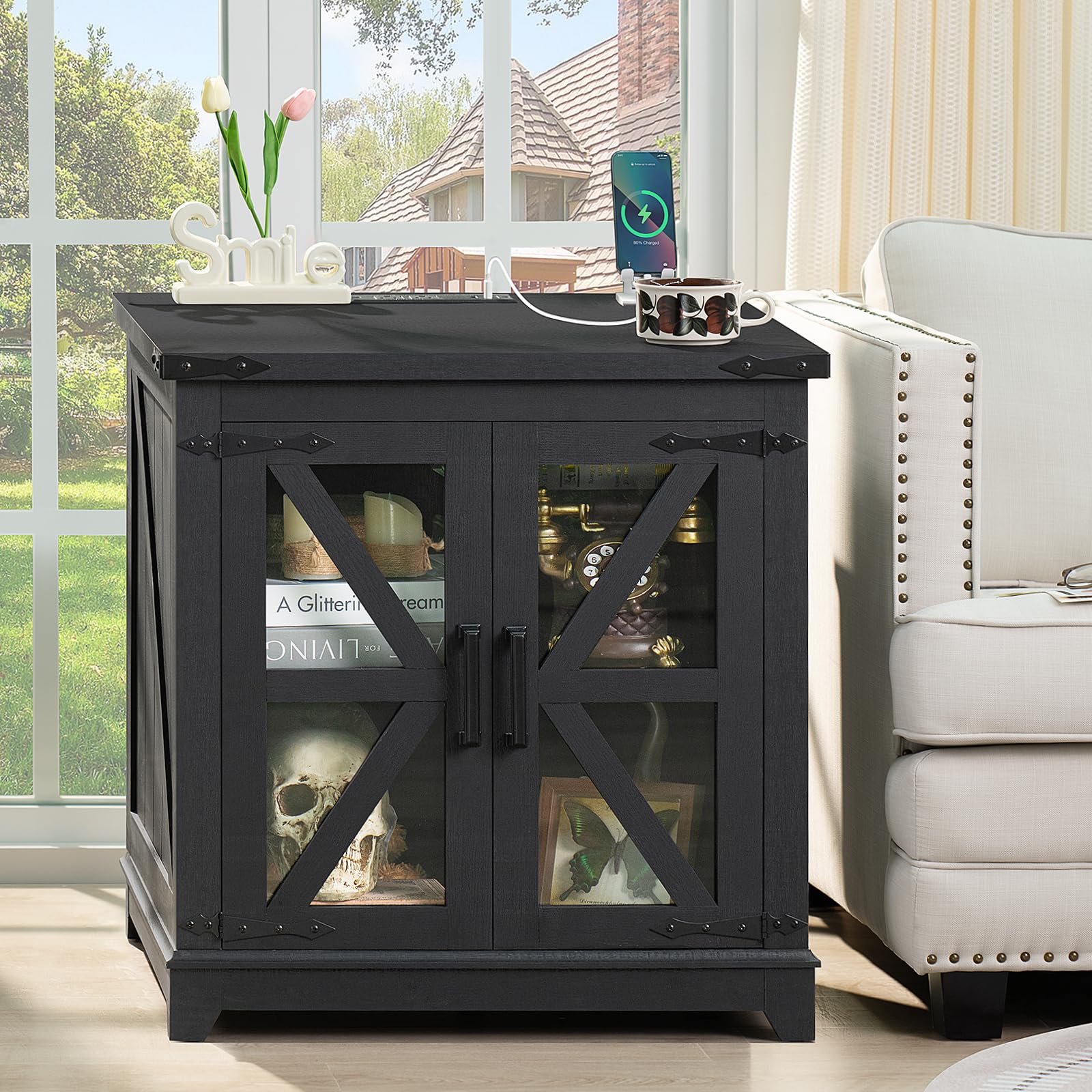 Farmhouse end table with barn-door glass panels and dark top, used as bedside stand.