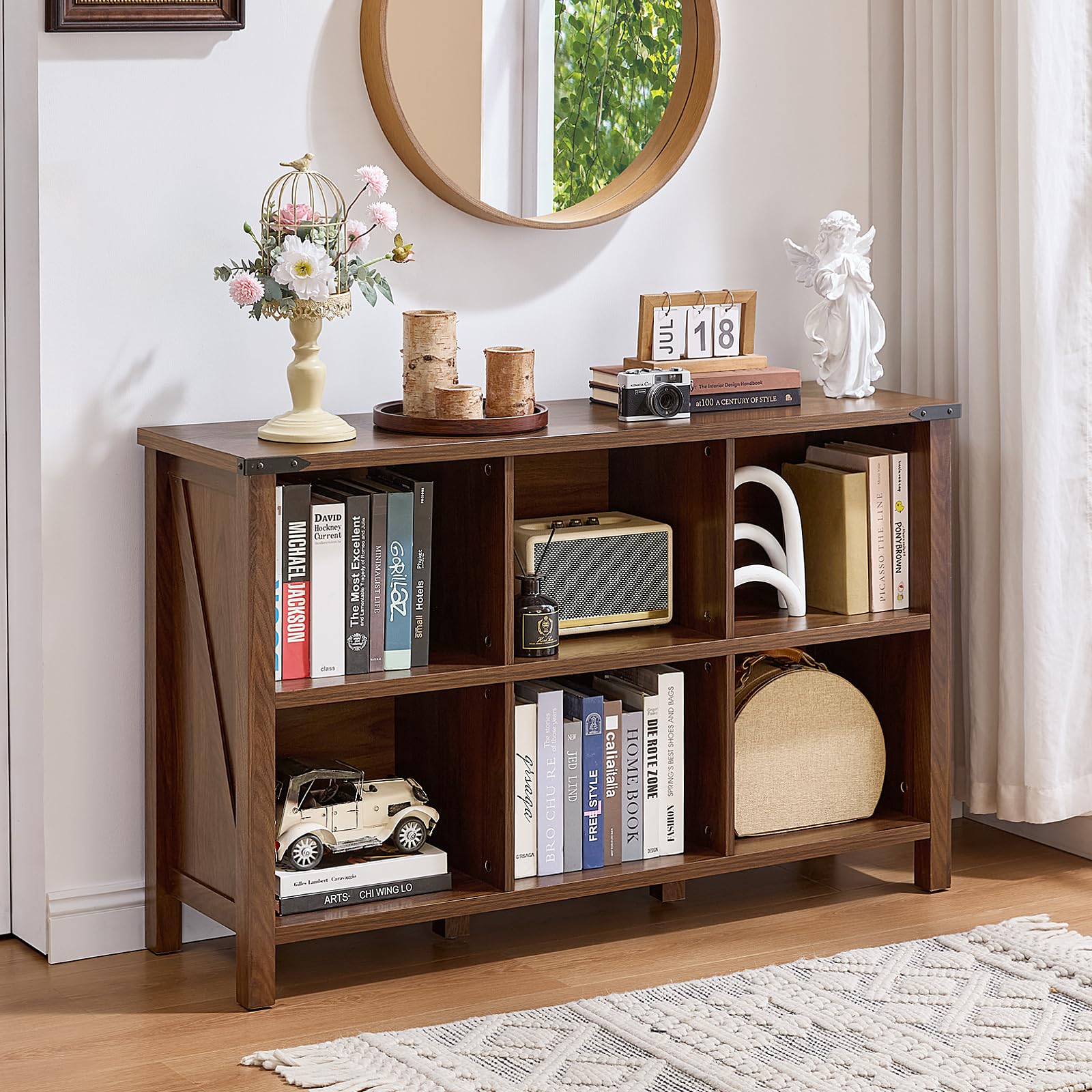 Brown wood low storage bookcase with open cubbies and display shelves on legs