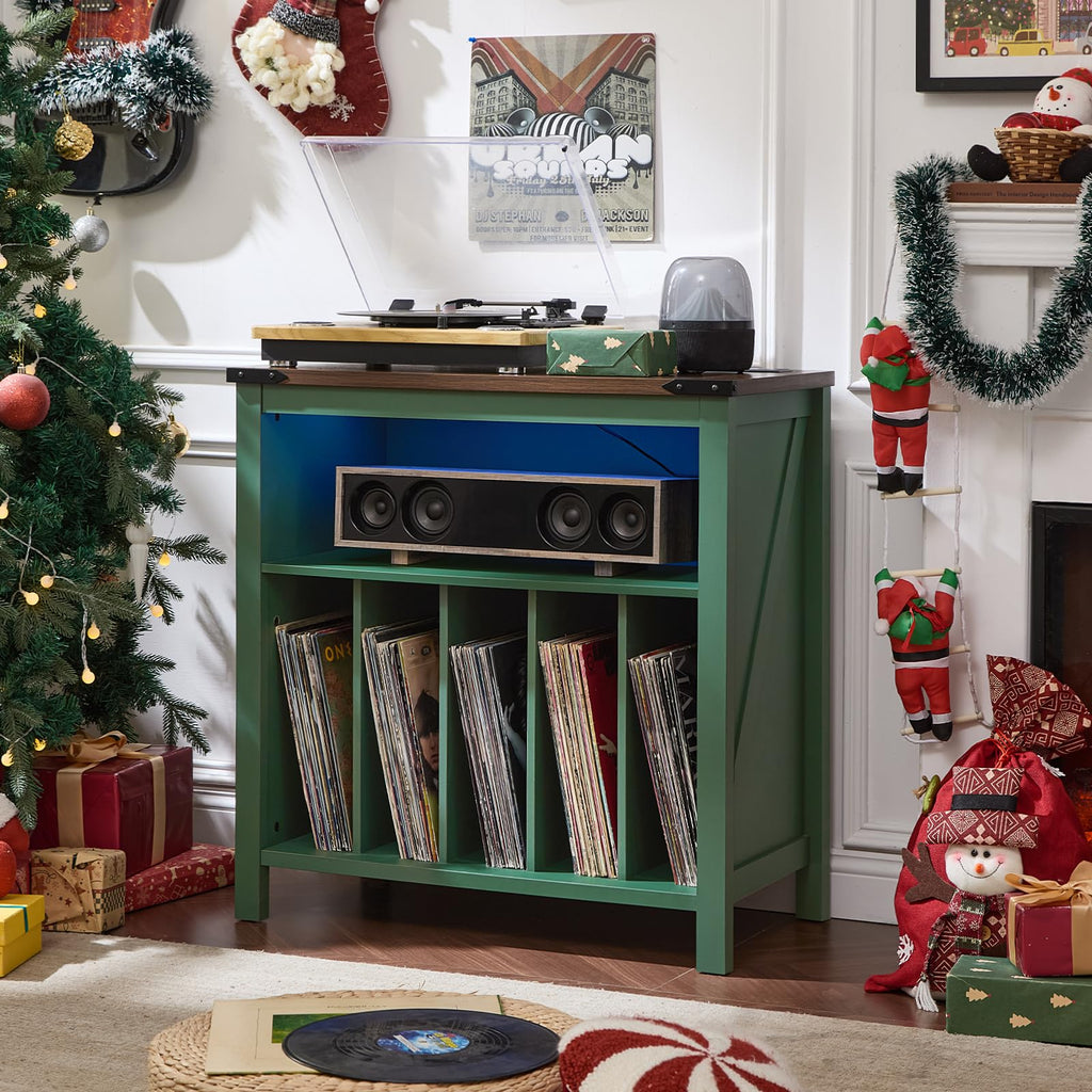 Green record player cabinet with open shelf for vinyl records and front storage.