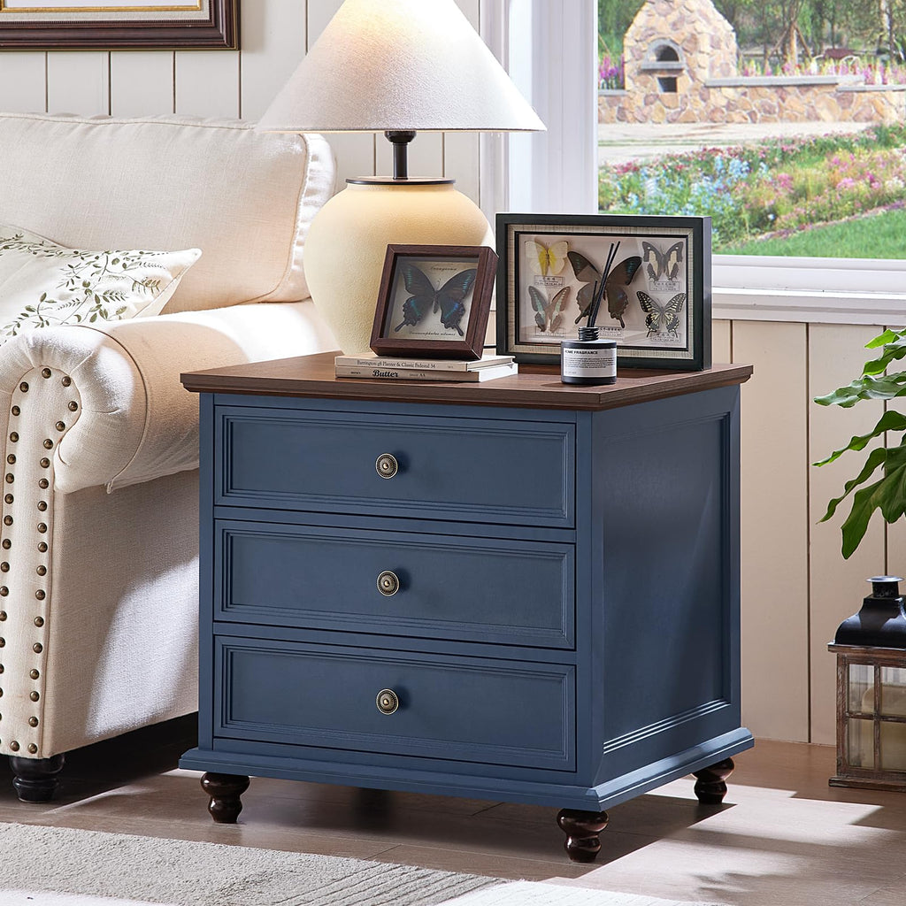 Blue cabinet-style dresser with four drawers and round knobs on wooden feet