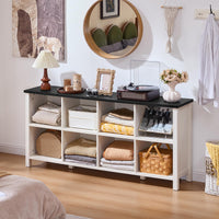 White console bookcase with open cubbies and shelves, styled with decor and baskets