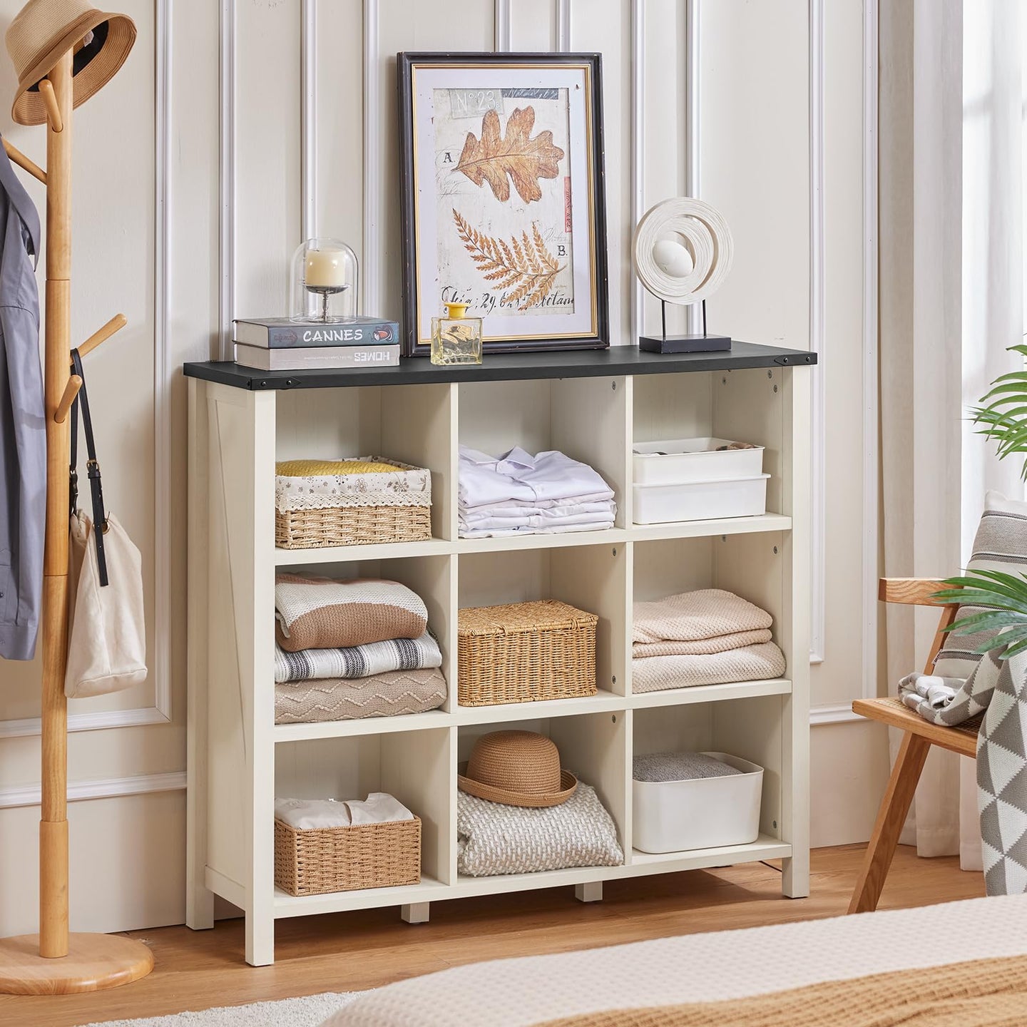 White open bookcase with cubby storage and a flat top for framed decor and baskets