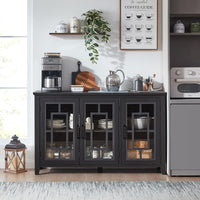 Black sideboard buffet cabinet with four glass-front doors and open interior storage shelves.