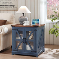 Blue farmhouse end table with wood top and glass barn doors, tablet on top