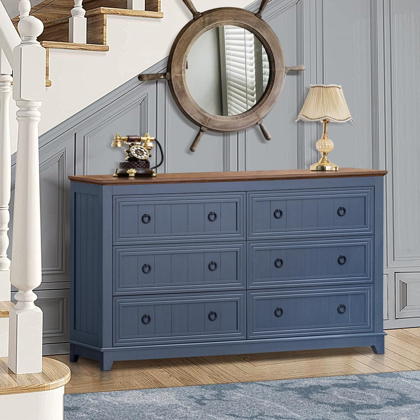 Blue six-drawer dresser with round knobs and sturdy legs, angled view with top surface