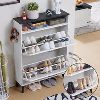 White shoe organizer cabinet with open flip shelves holding shoes in compartments