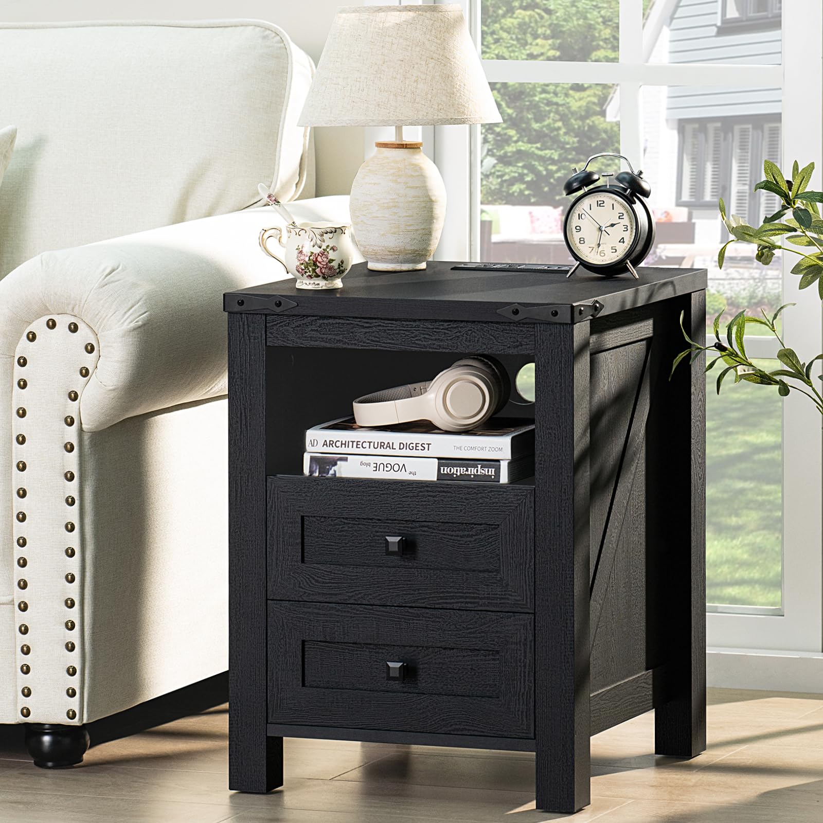 Dark nightstand with 2 drawers and open shelf, tablet and decor on top