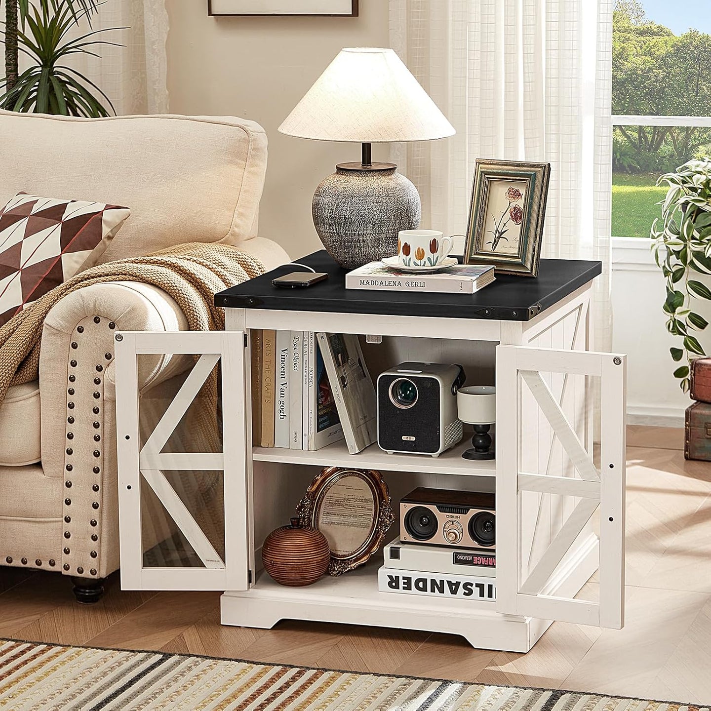 White nightstand with glass barn doors and open shelving for decor and devices.