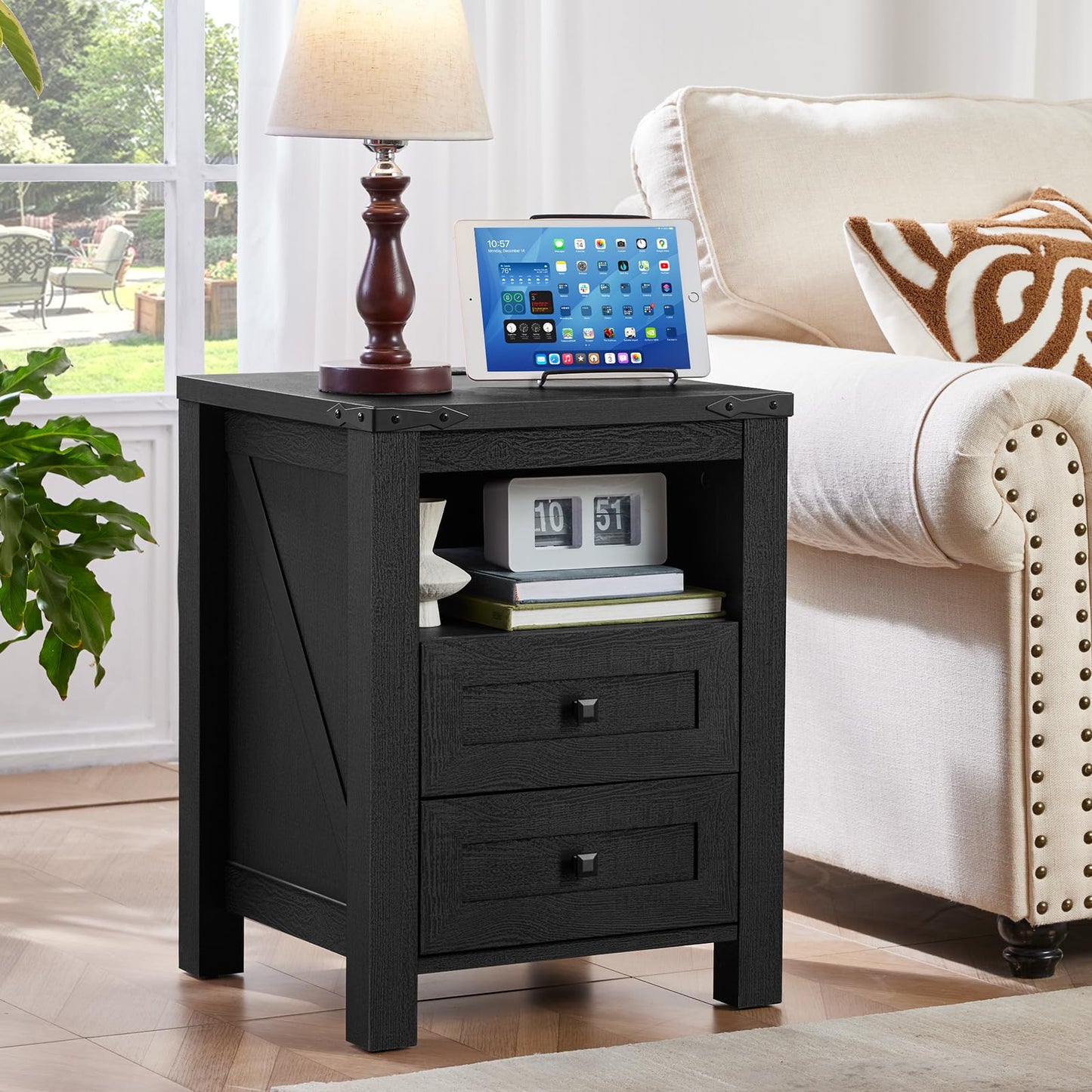 Dark blue nightstand with two drawers and open shelf, tablet and lamp on top