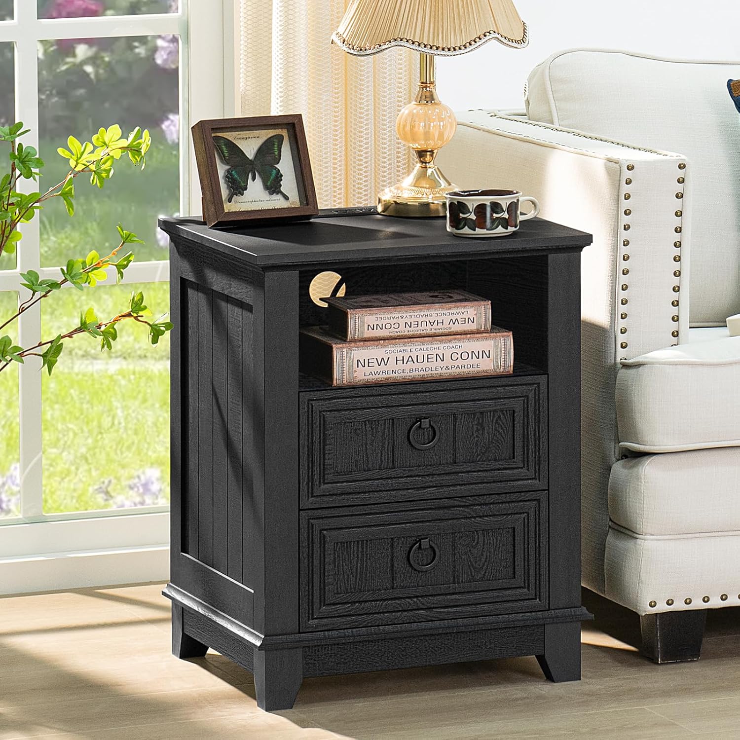Black wooden nightstand with open top, two drawers with round knobs, and side panels