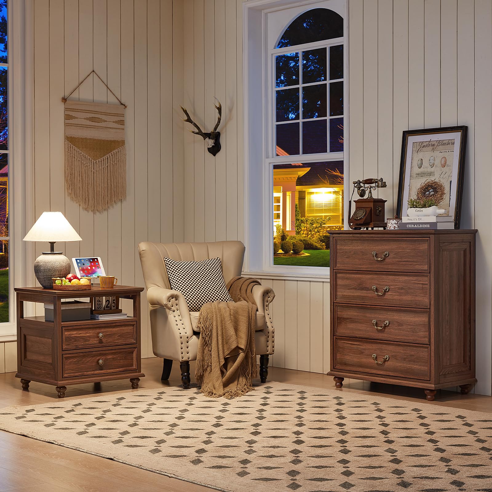 Dark wood dresser with multiple drawers, metal knob handles, and rounded feet