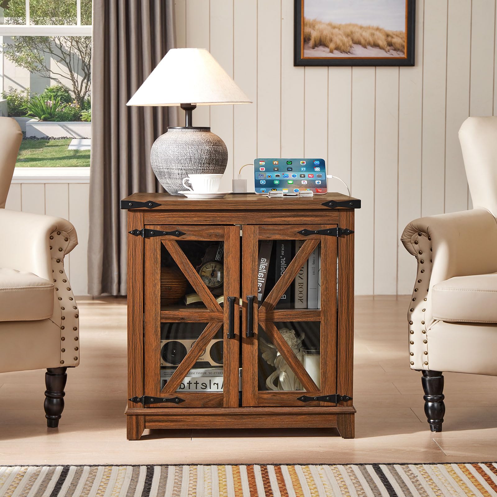Brown wood end table with black top, glass barn doors, and charging device on top