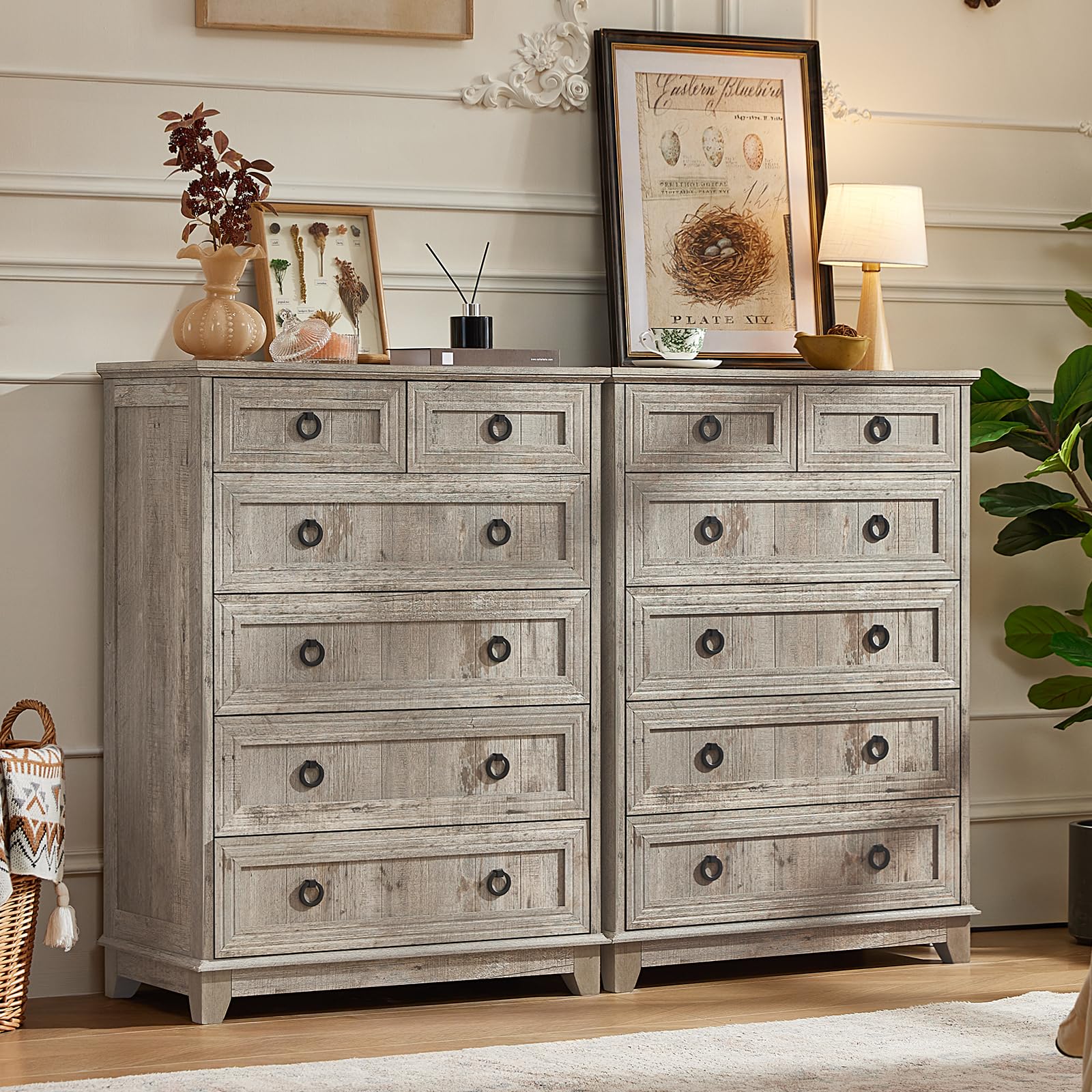Grey wash farmhouse dresser with multiple drawers and round metal knobs on drawer fronts.