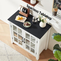 White sideboard cabinet with black tabletop and two glass doors