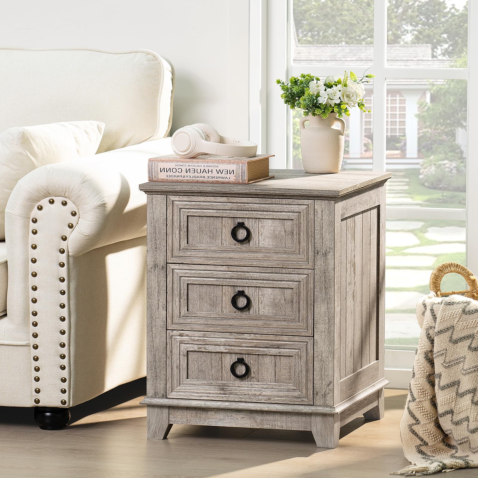 Gray farmhouse nightstand with three drawers and round metal knobs