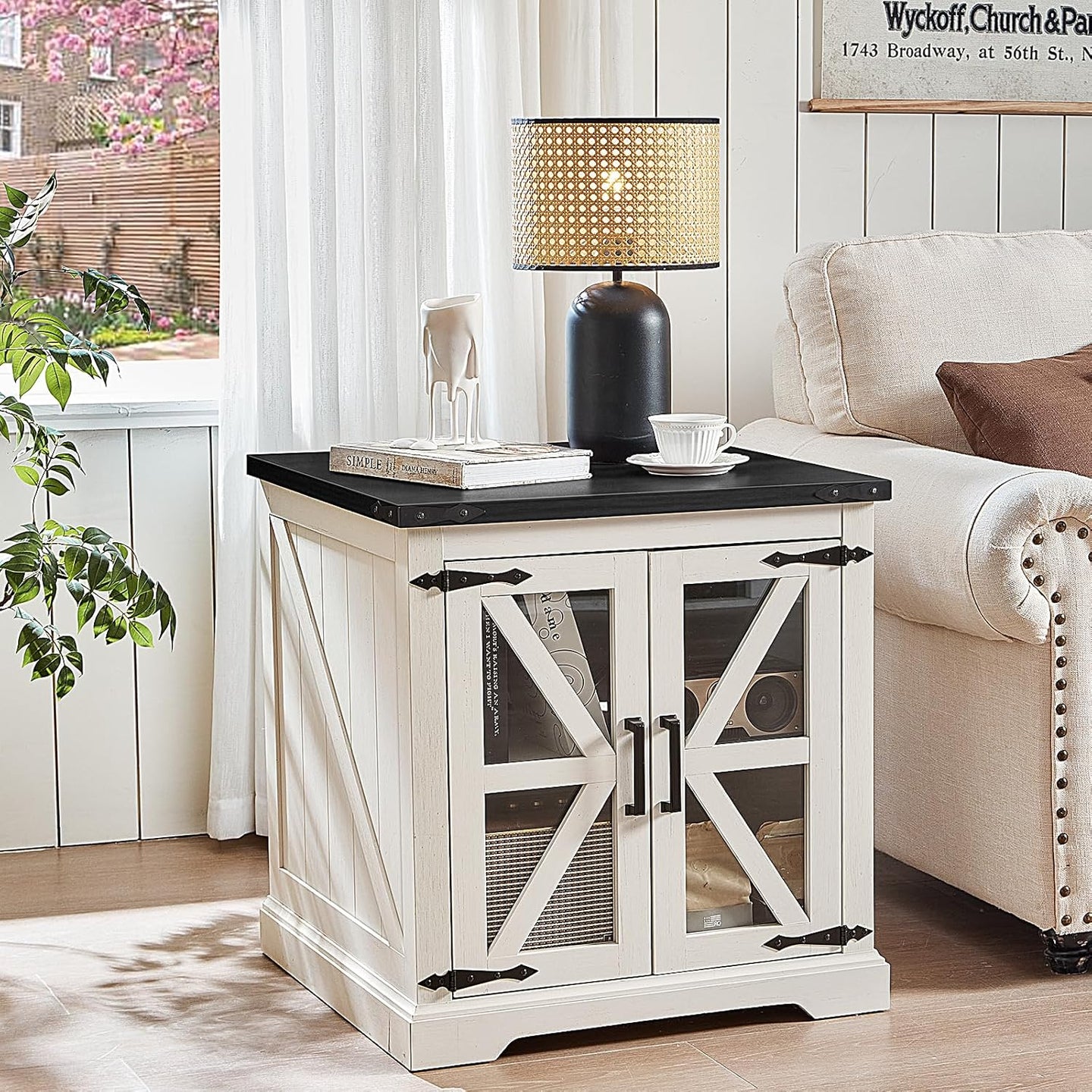 White farmhouse nightstand with glass barn doors and black tabletop.