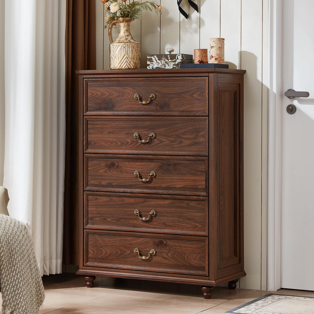 Brown wood dresser with multiple drawers and brass-tone pull handles