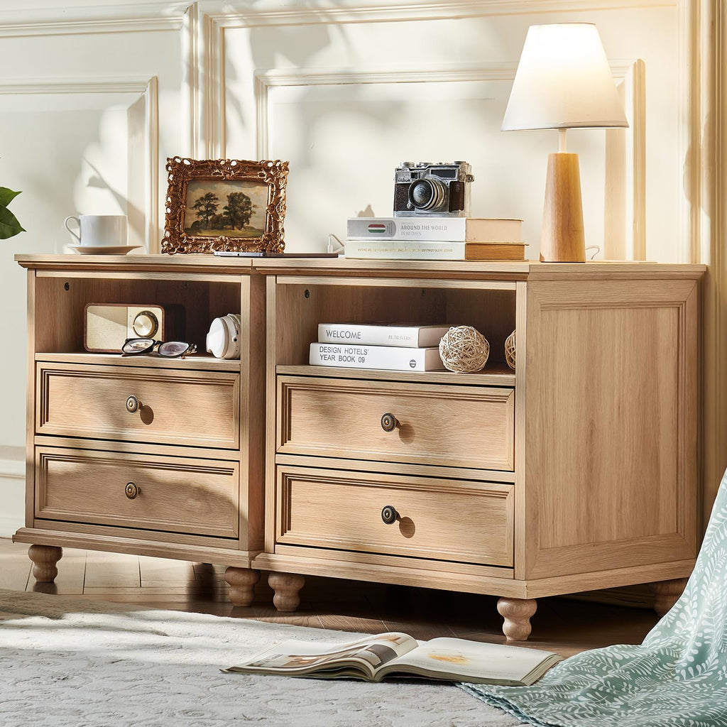 Light wood dresser with four drawers and bronze knobs, on turned feet